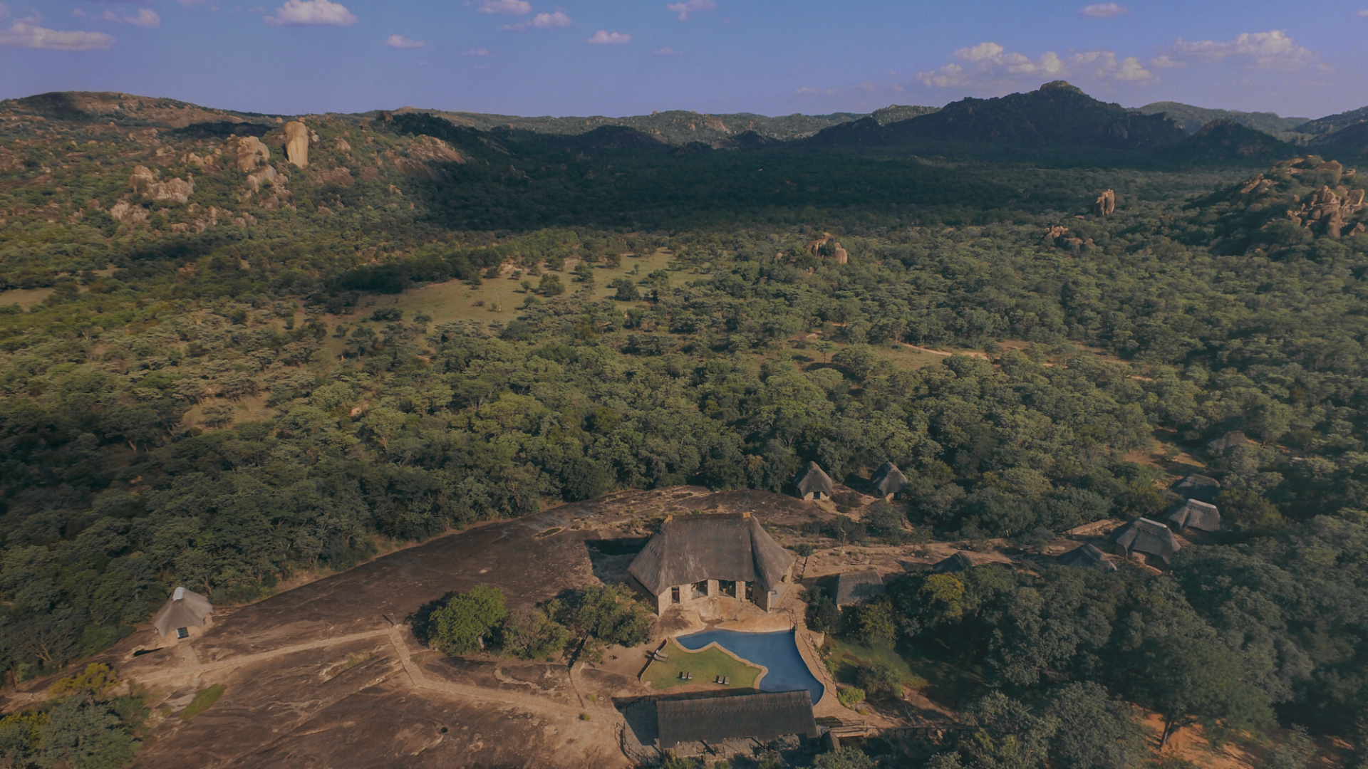 Matobo Hills Lodge, Zimbabwe — aerial view of the lodge, pool and granite landscape