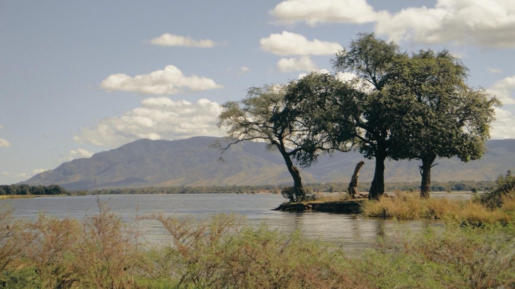 Lake Kariba Zimbabwe sunset dead trees silhouette inland sea houseboat
