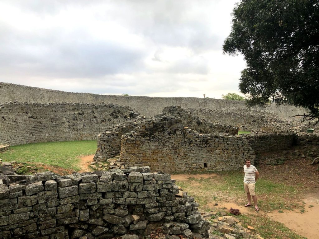 The Great Enclosure and ancient stone walls of Great Zimbabwe under a dramatic sky