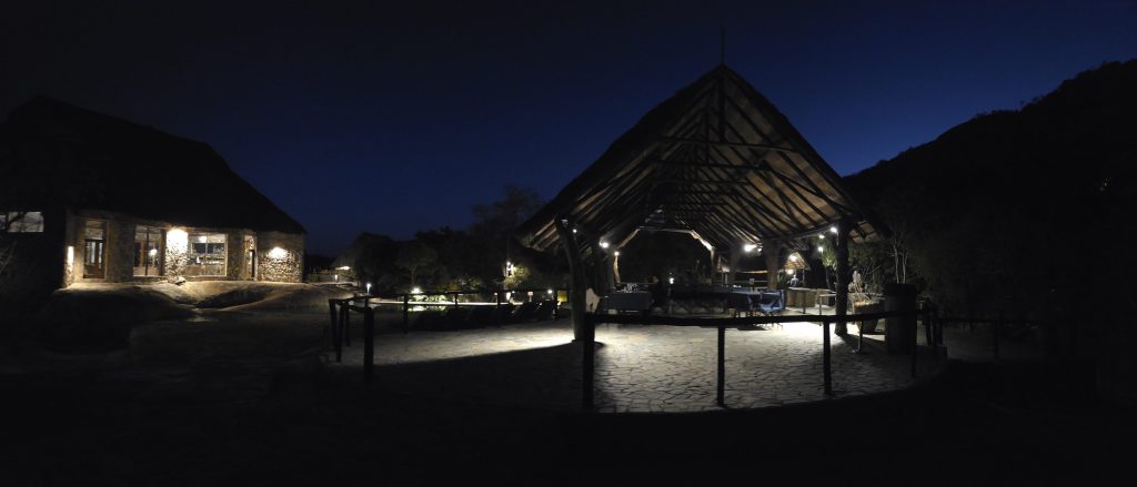 Matobo Hills Lodge at dusk, granite kopjes behind