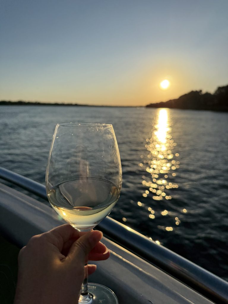 Sundowner on a Zambezi River cruise at sunset, Victoria Falls