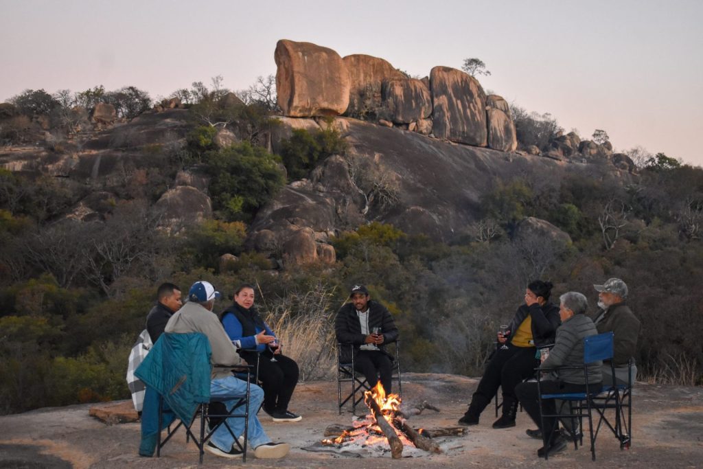 Guests gathered around the fire in the Matobo Hills.