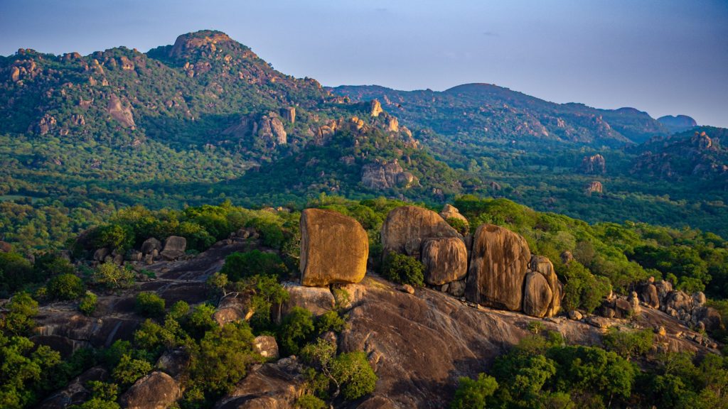 Golden hour panorama of granite kopjes in the Matobo Hills