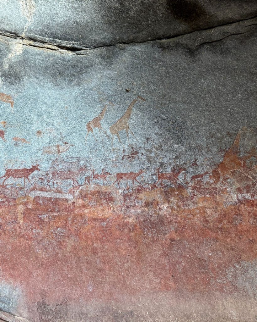 San rock art panel — giraffe and antelope pigments on granite, Matobo Hills