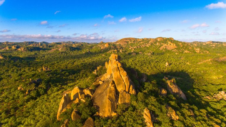 Matobo Hills aerial drone view granite landscape Zimbabwe green season blue sky