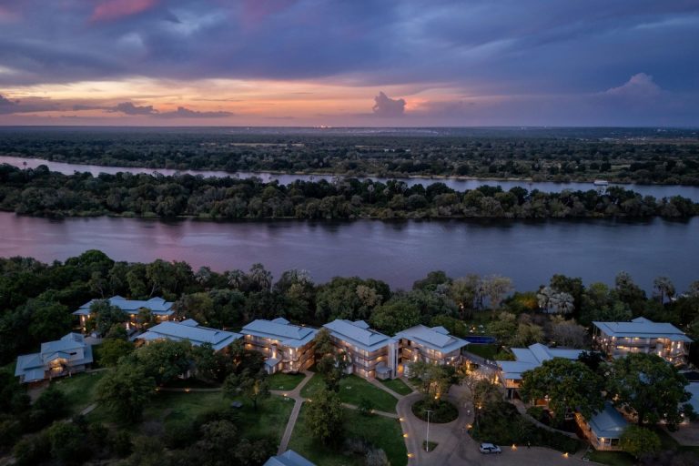 The hotel from the air at dusk at Palm River Hotel