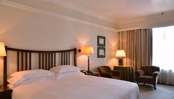 A guest bedroom at the Meikles Hotel in Harare